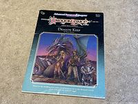 Front cover of Dragon Keep RPG module showing fantasy artwork of characters and dragon with title and branding.