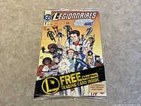 Front cover of Legionnaires #1 DC comic book from 1993, factory sealed in cellophane, displaying multiple superhero characters and promotional banner for free Skybox trading card inside.