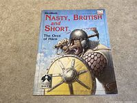 Front cover of Nasty, Brutish and Short RPG supplement showing an orc with shield and club.