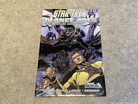 Front cover photo of the sealed Star Trek Planet of the Apes The Prime Directive comic showing dynamic illustrated characters.