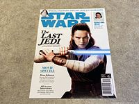 Front cover of Star Wars The Official Magazine The Last Jedi souvenir issue, showing Rey with lightsaber and headline indicating special content on The Last Jedi and Princess Leia.
