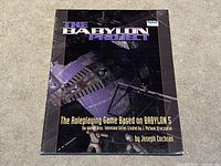 Front cover of The Babylon Project roleplaying game book showing title, author, and Babylon 5 space station artwork.