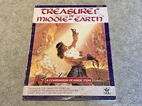 Front cover of Treasure of Middle-Earth RPG book showing fantasy battle artwork and title.