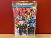 Full front view of the sealed Wizard: The Guide to Comics issue 12 magazine with Jim Lee cover art and trading card included.