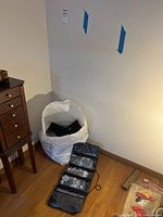 Photo showing a large white bag containing the jewelry organizer and other items.