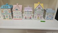 All five Lenox Village canisters arranged side by side