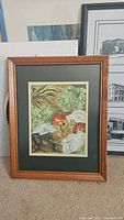 Framed original painting of apples and grapes with wood frame and green matting.