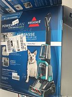 Box showing Bissell PowerClean TurboBrush Pet rug cleaner with product image and pet on box.