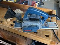 Ryobi electric planer showing top side and handle