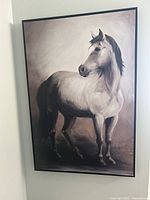 Full view of the large canvas painting showing a white horse standing.