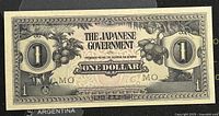 Front side of 1942 Malaya Japanese Occupation 1 dollar banknote showing text, denomination and decorative fruit graphics.