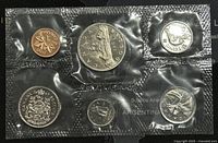 Photo showing front of 6 Canadian proof-like coins sealed in original packaging.
