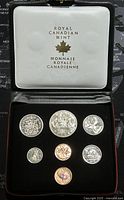 Seven Canadian coins in black velvet case with white Royal Canadian Mint cover