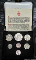 Photo showing seven Canadian coins from 1974 set in black display case with explanatory card