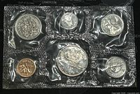 Photo shows front view of 6 Canadian coins in original sealed plastic holder with proof-like finish from year 1975