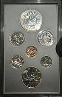 Photo showing seven Canadian coins from 1978 in specimen condition arranged in black display case.