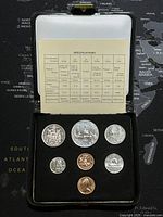 Full view of 1980 Canadian uncirculated coins set in black holder with specification sheet inside cover