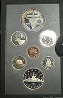 Complete 1982 Canadian proof coin set showing a 50% silver double dollar coin along with other denominations in original casing.