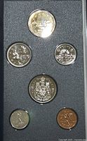 Top view of 6 Canadian specimen coins in black foam enclosure showing obverse and reverse sides