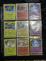Photo of nine Pokémon cards displayed in a transparent protective sheet, showing front details of Oddish, Magcargo, Alolan Vulpix, Tangela, Pikachu, psychic type card, Grubbin, Charmander, and another Alolan Vulpix card.