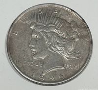 Front (obverse) face of 1922 Peace Silver Dollar Coin showing Lady Liberty profile with radiate crown and inscriptions.