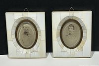 Pair of antique portrait photo miniatures in white and cream inlay tile rectangular frames with oval brass inner frames, each containing a black and white portrait of a man in vintage military uniform.