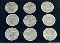 Nine circulated Canadian commemorative $1 coins laid out in three columns on a black background showing the obverse sides.