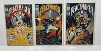 Photo showing the front covers of Peacemaker comics issues #1, 2, and 3 bagged and boarded.