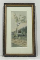 Vertical view of entire framed watercolor painting showing tree, path, and hill in background.