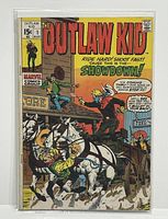 Front cover photo of The Outlaw Kid #1 Marvel comic showing Western-themed shootout scene with cowboys and horses, bagged and boarded for protection.