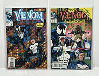 Two bagged and boarded comic books side by side, Venom: Funeral Pyre issues #1 and #3 with colorful character covers.