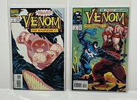 Front view of both comic books, Venom: The Madness #1 and #3, displayed side-by-side in protective sleeves.