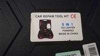 Photo showing label with product name 'Car Repair Tool Kit' 5 in 1, 12V lighter powered, made in China, CE mark