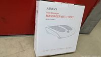 White Atmoo brand foot massager with heat model HP086A in original packaging showing closed box with branding and product name.