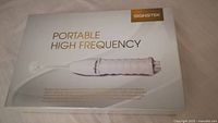 Box of Signstek Portable High Frequency device showing product image and branding.