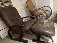 Overall view of the chair and ottoman set showing frame and cushions