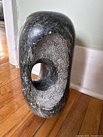 Front three-quarter view showing overall shape and central hole