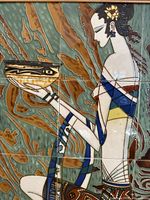 Close-up of tile art showing woman holding a bowl with decorative background