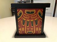 Front view of box showing painted formline design