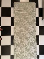 Full view of Nikken KenkoPad topper showing floral pattern