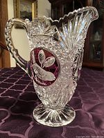 Front view showing bird medallion, handle and cut pattern