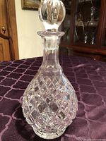 Full view of crystal decanter front with stopper attached