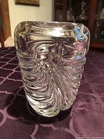 Full view of clear crystal vase showing spiral ribbed exterior