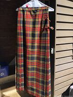 Front view of tartan kilt on hanger