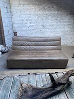 Front view of straight module against white brick wall in good lighting.