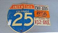 View of all highway sign and license plates displayed on table