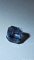 Top view of octagon-cut platinum blue sapphire on neutral background
