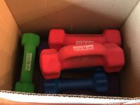 Box containing green 2 lb, red 3 lb dumbbells, visible Sportworks branding
