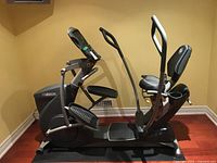Side view of entire Octane Fitness recumbent elliptical on floor mat