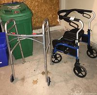 Two walkers visible side by side: an Evolution walker with seat and a standard silver metal walker.